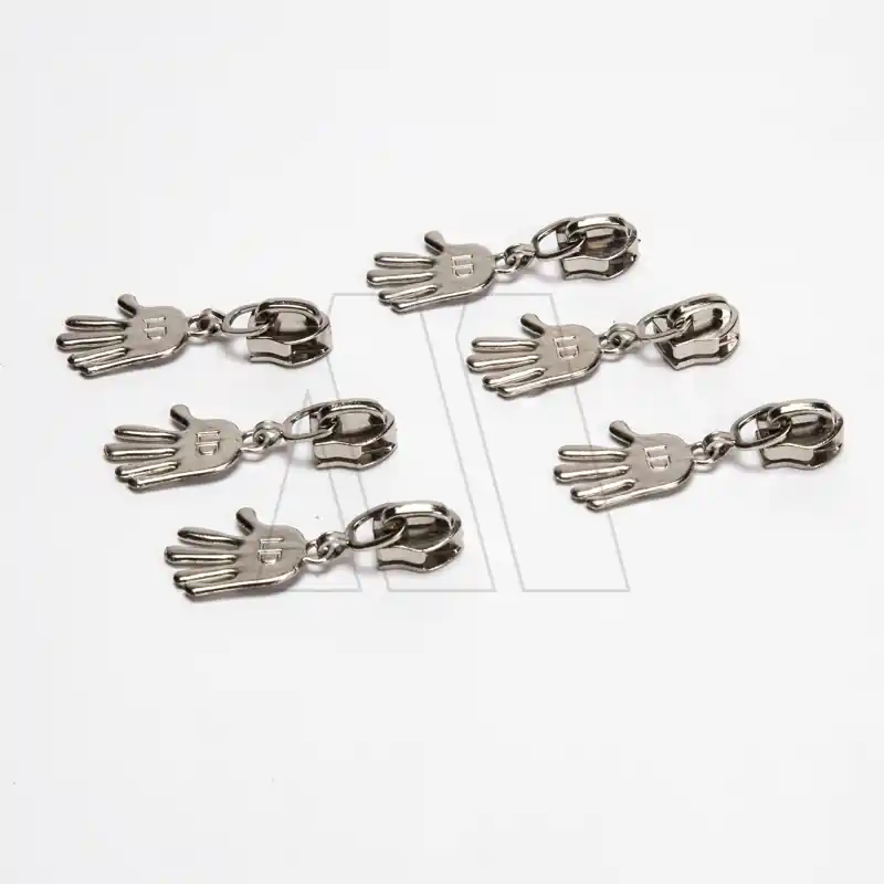 DESLIZADOR CIERRE 6MM C/COLGANTE MANITO X 50UN