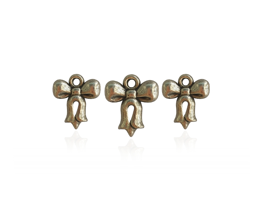 DIJE SIMIL METALICO MOÑO 13MM X 15MM X 50GRS 280UN APROX 
