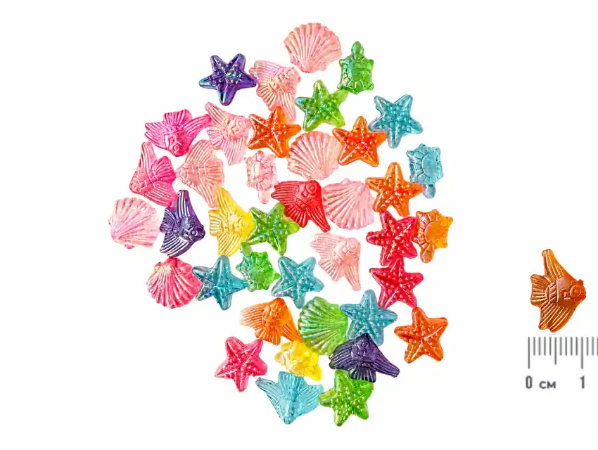 CUENTAS DE PLASTICO TRANSPARENTE MAR SURTIDO 10MM X 15MM APROX X 125GRS (250UN APROX)