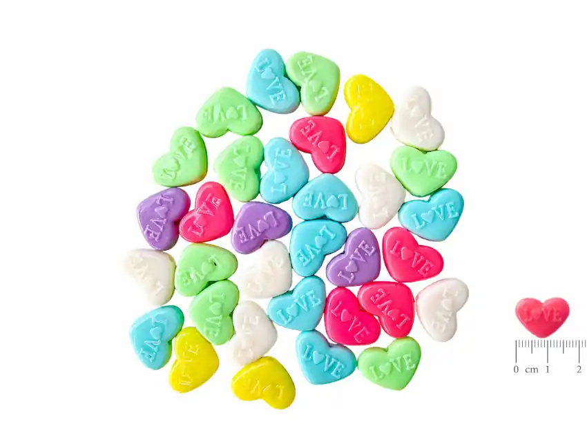 CUENTAS DE PLASTICO CORAZON 10MM X 17MM X 125GRS (250UN APROX)