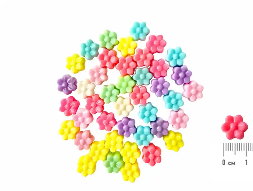 CUENTAS DE PLASTICO FLORES 10MM X 10MM X 125GRS (125UN APROX)